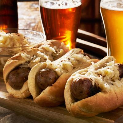 a close up of food and a glass of beer on a table