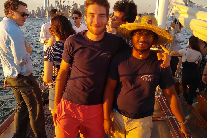 a group of people standing together smiling for the camera