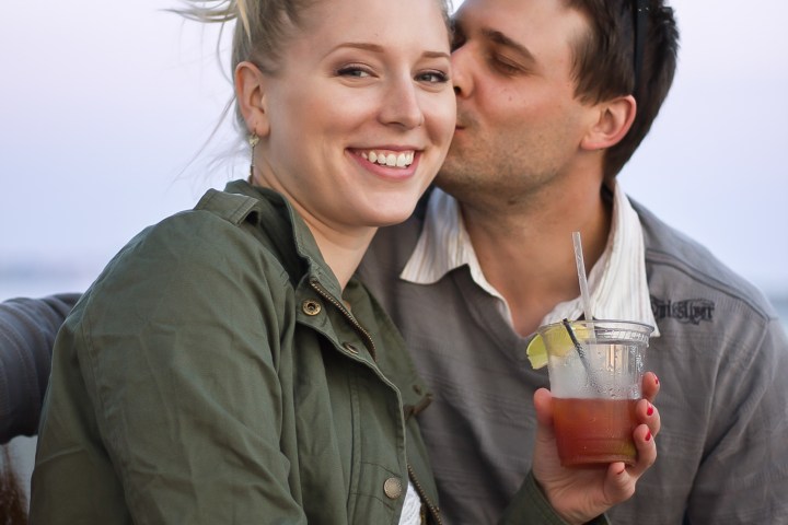 a man and a woman looking at the camera
