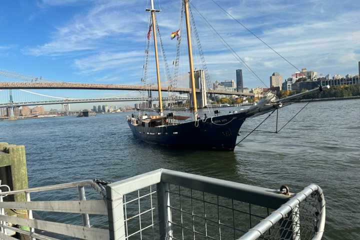 a boat is docked next to a body of water