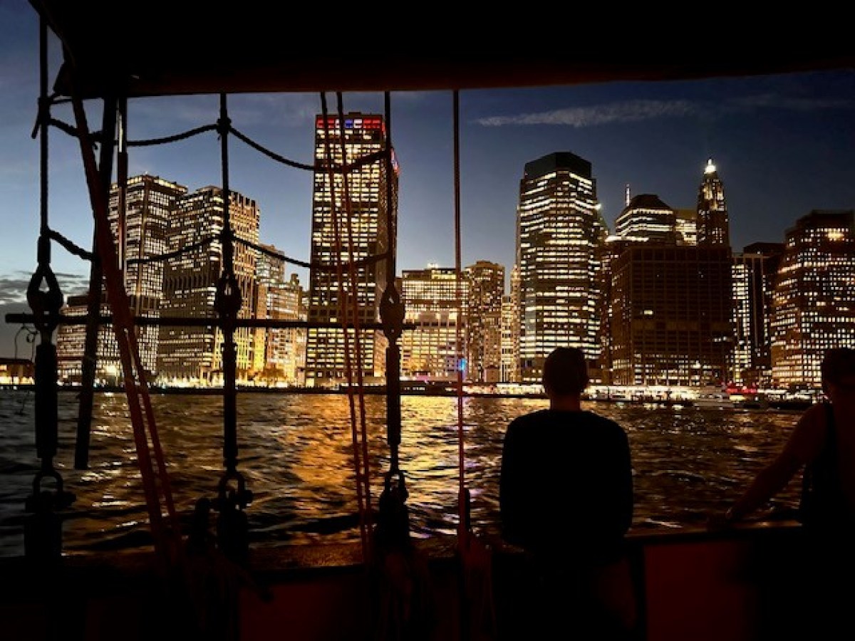a view of a body of water with a city in the background